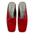 red glossy mules