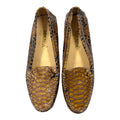 brown snakeskin loafers with a glossy finish